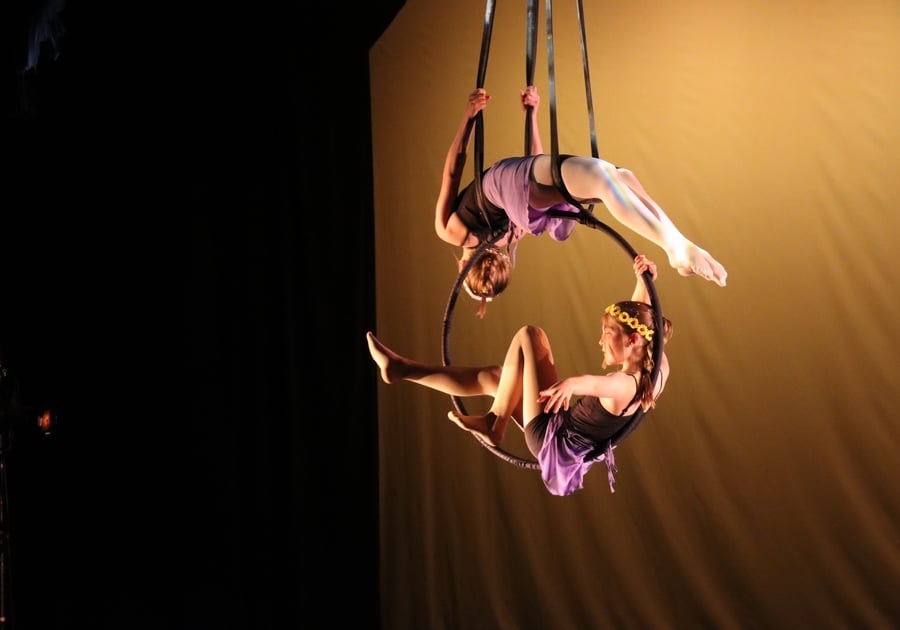 two girls performing on an aerial hoop at Gravity Aerial Arts summer camp