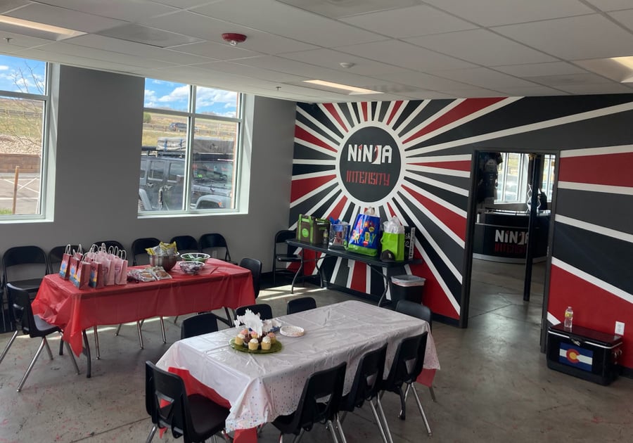Party Room at Ninja Intensity has two tables, lots of chairs, side table for gifts