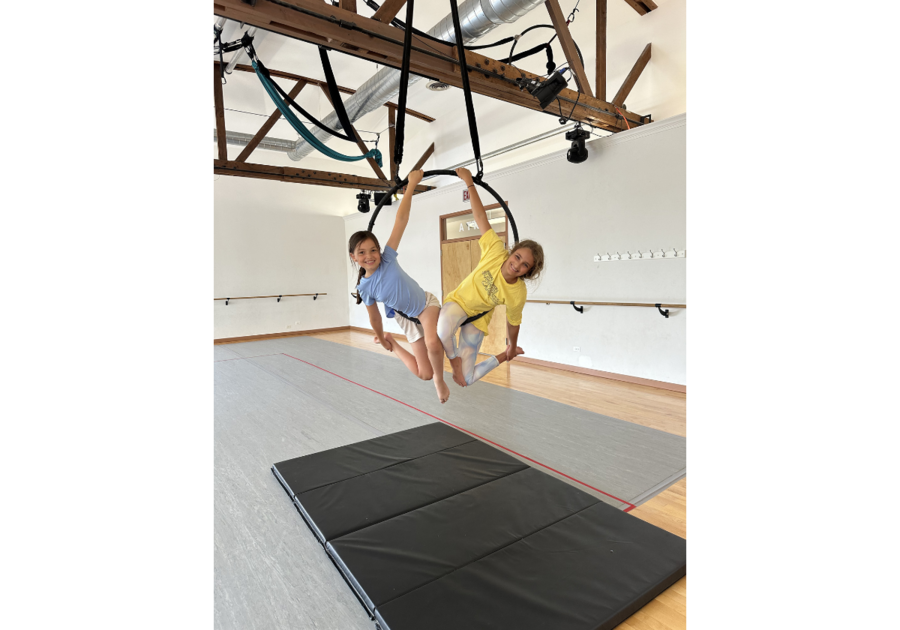 two girls on aerial ring