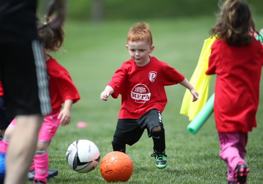 Penn Fusion Soccer Academy player chasing a soccer ball