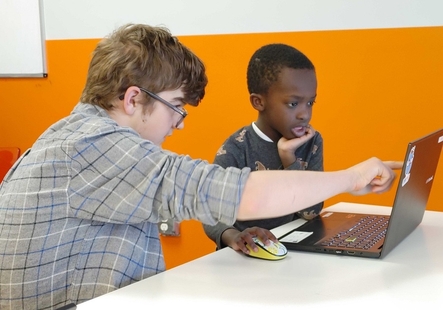 Boy and teacher at computer