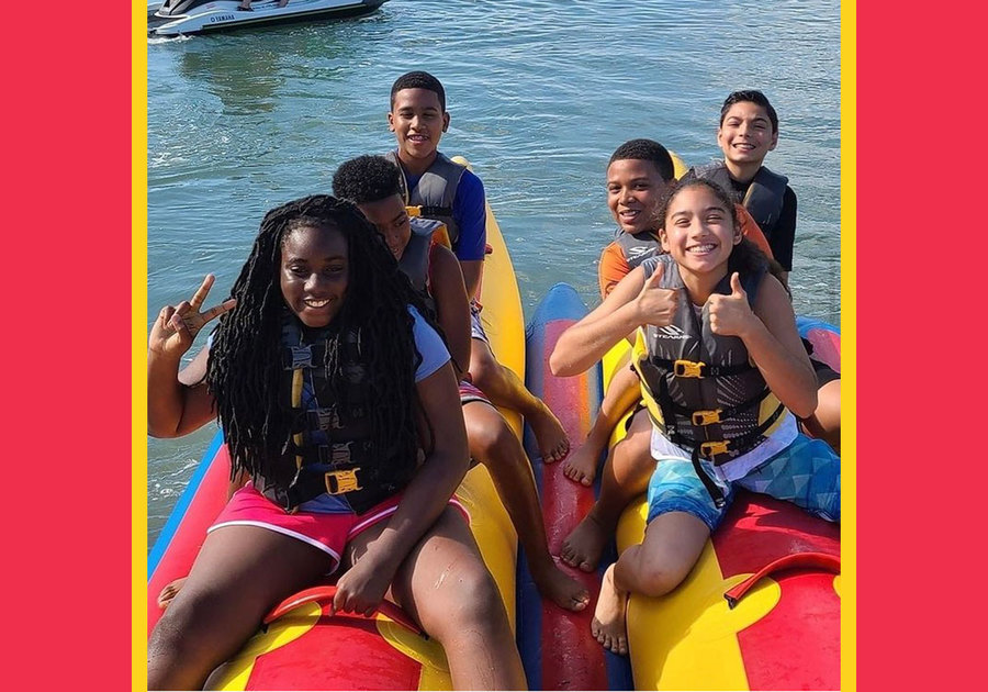 END It! 2022 Summer Camp kids on raft in water