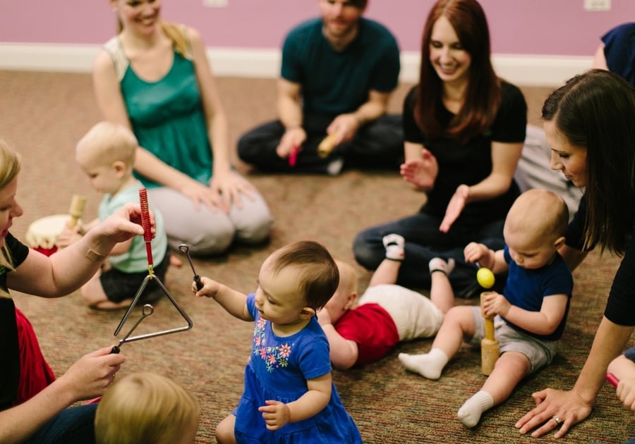 babies playing with musical instruments