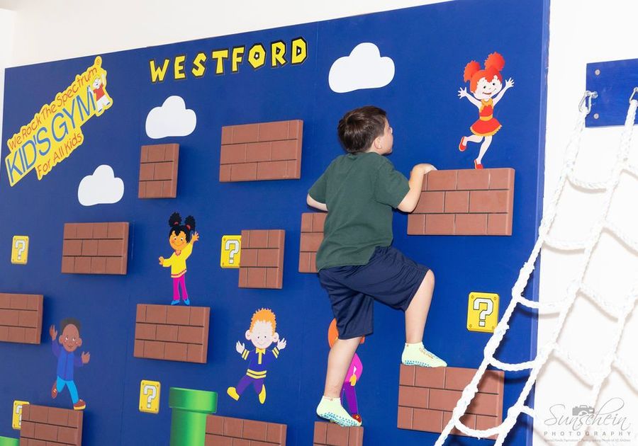 Child playing on climbing wall