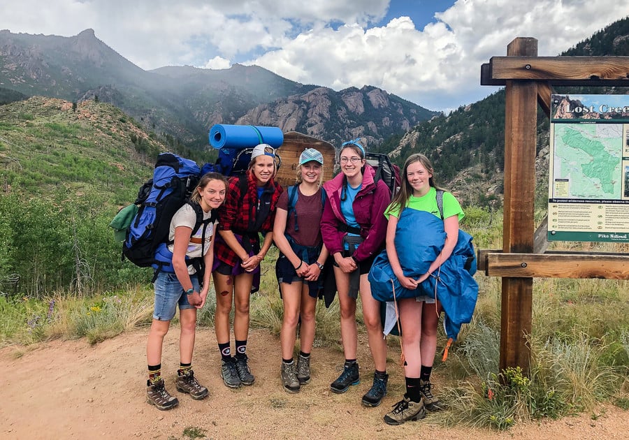 5 smiling girls going backpacking at Girl Scouts of Colorado summer cmap