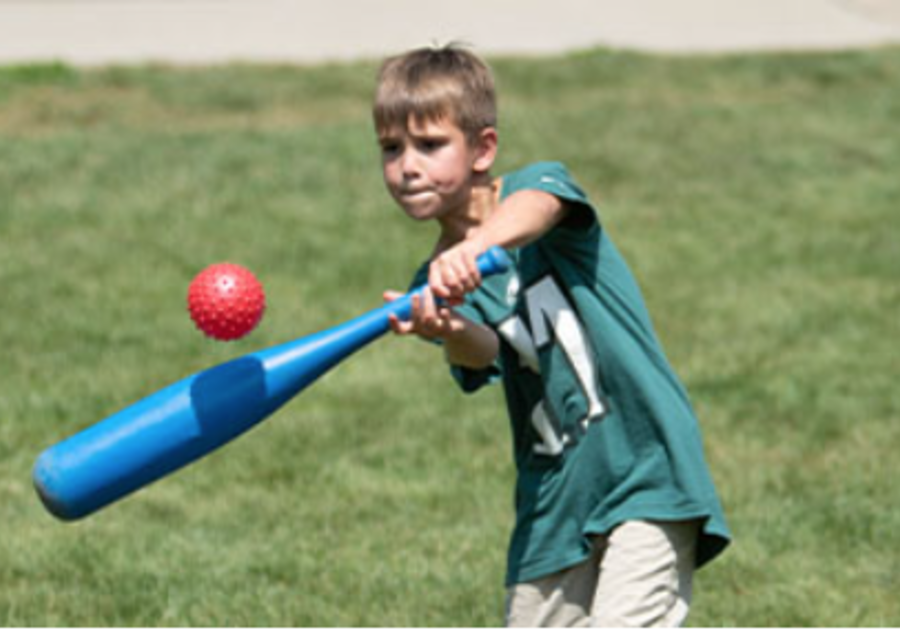 Boy hitting a bat