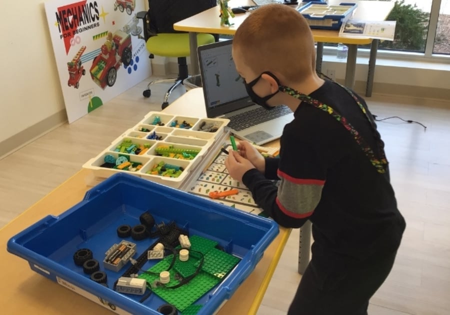Boy assembling LEGOs