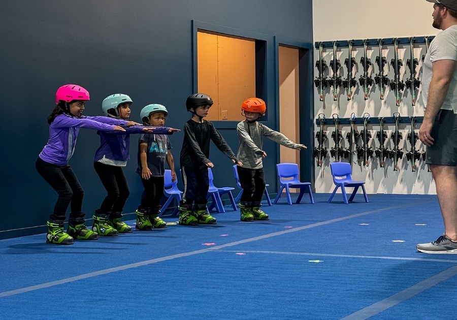 5 kids learning how to ski indoors