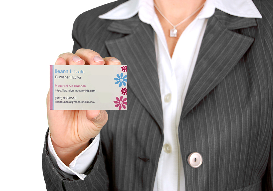 Business Woman holding out a business card.