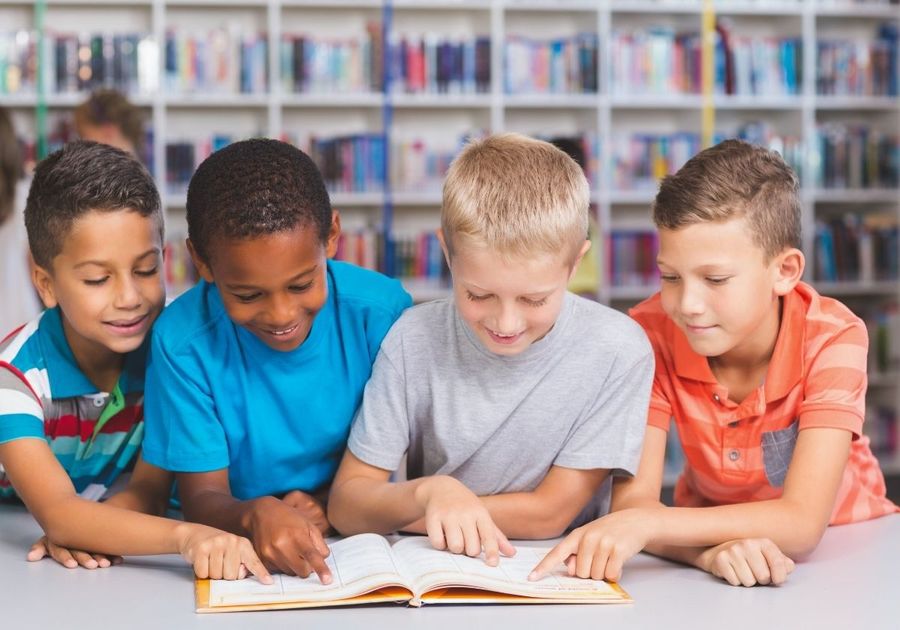 group of boys reading together