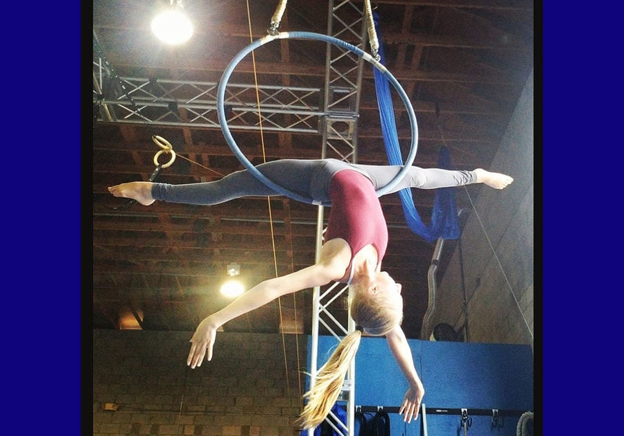 Girl acrobat on rings at Momentum Academy