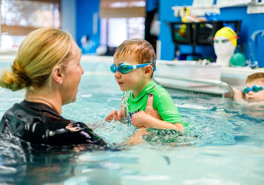 Child and instructor in SwimLabs swim lesson