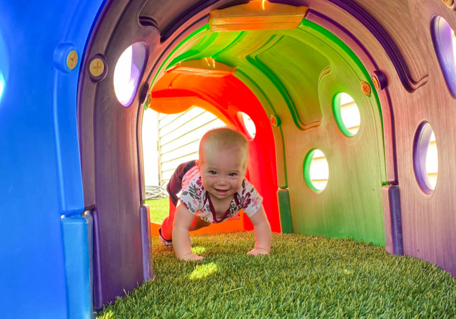 Asbury Child Development Centers Inc. baby playing outside