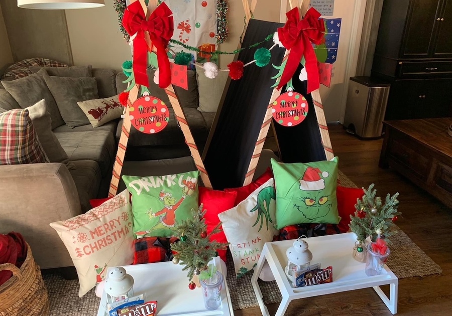 Grinch-themed slumber party setup for two in living room