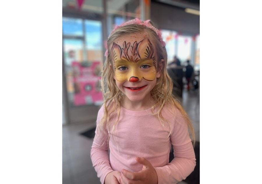 girl with reindeer face paint