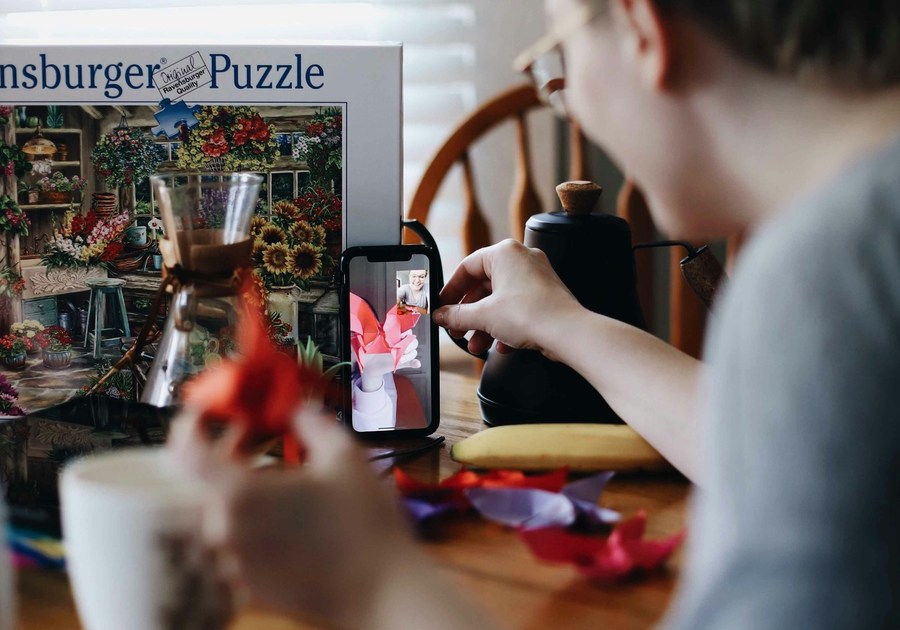 Boy with puzzle drinking hot cocoa