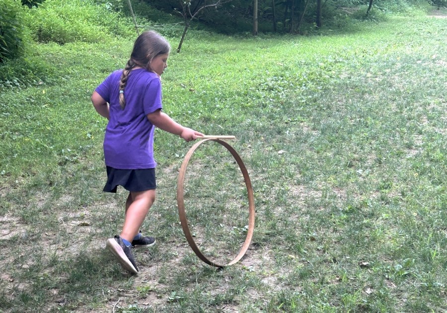 Newlin Grist Mill Summer Discovery girl playing with spinning wheel toy