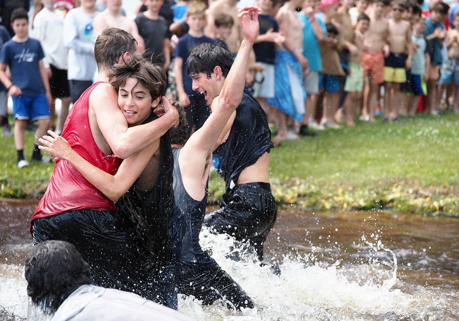 teen boys playing in creek