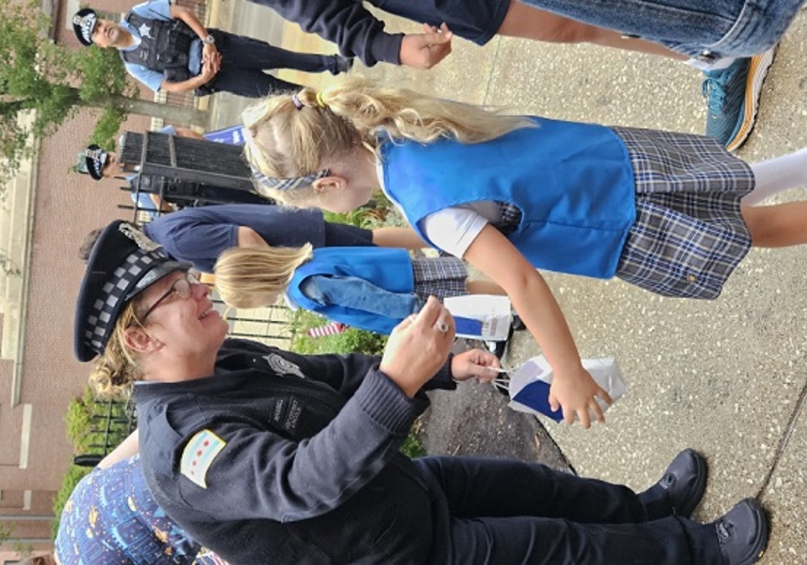girl scout talking to female cop
