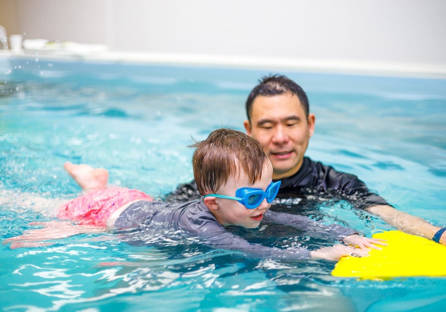 Child and instructor in SwimLabs swim lesson