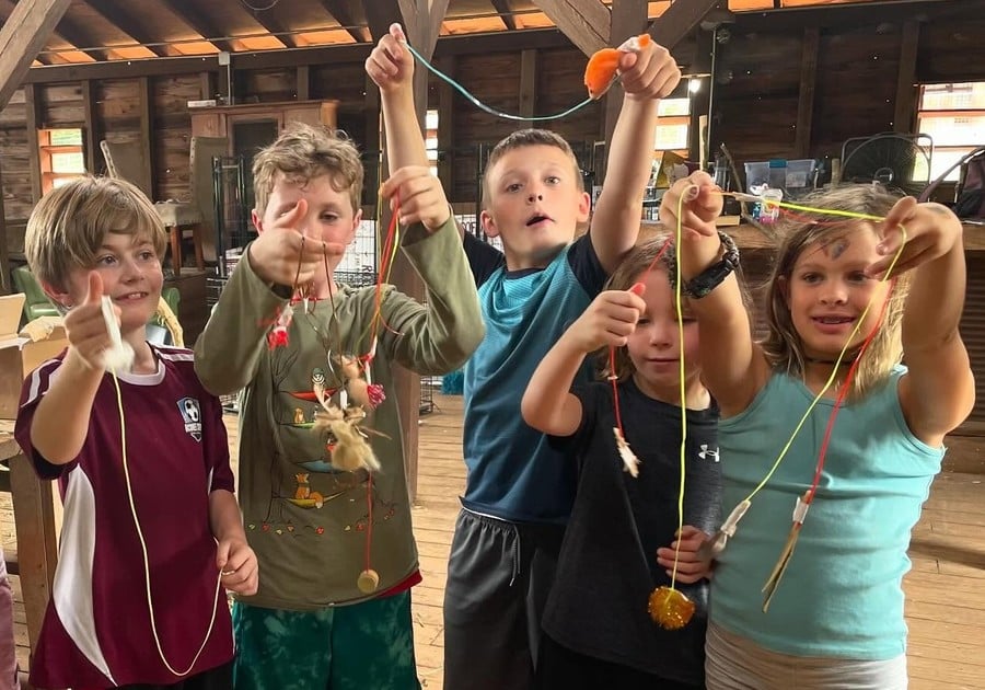 group of campers holding up project