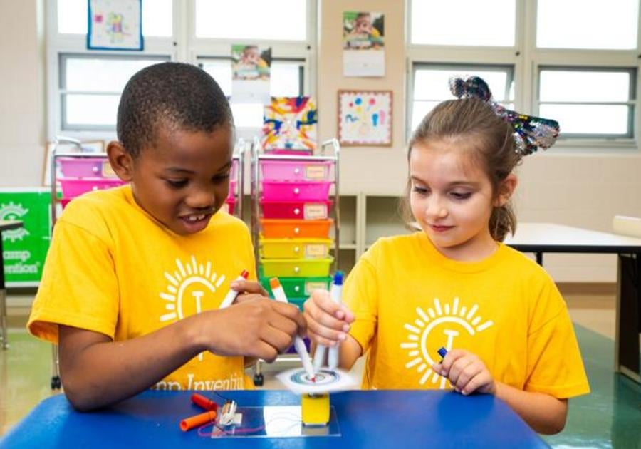 Camp Invention, kids participating in science experiment