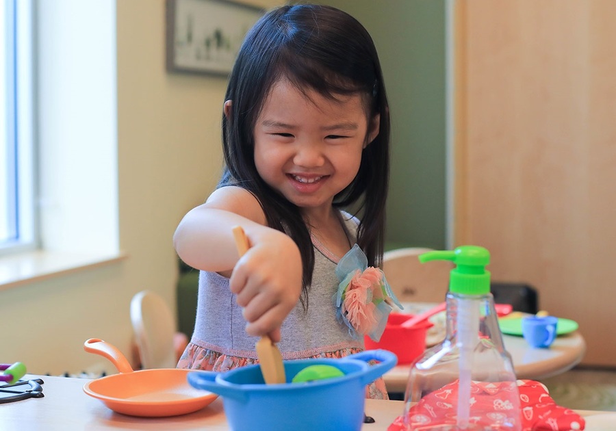 little girl pretending to bake