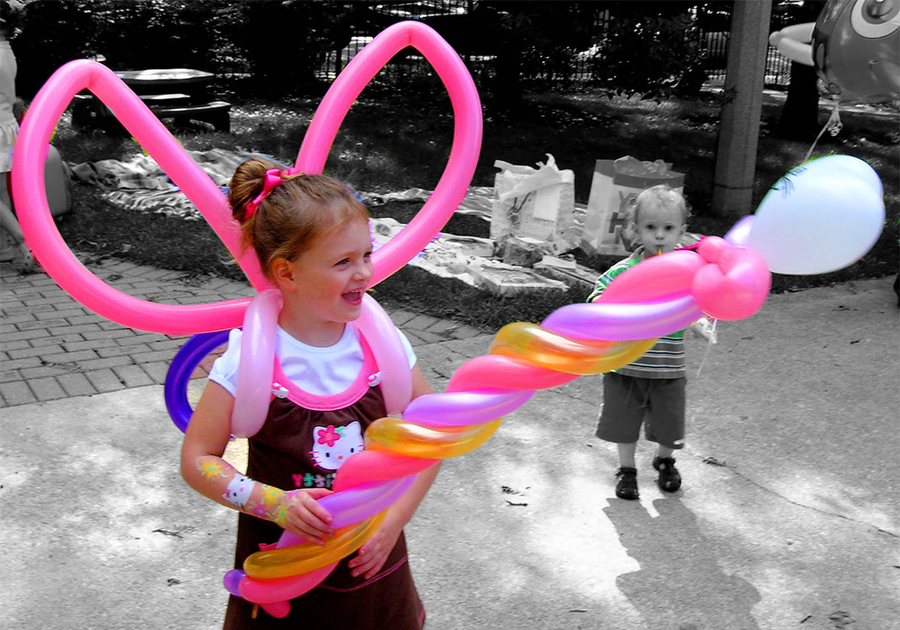 girl with balloon wings and wand