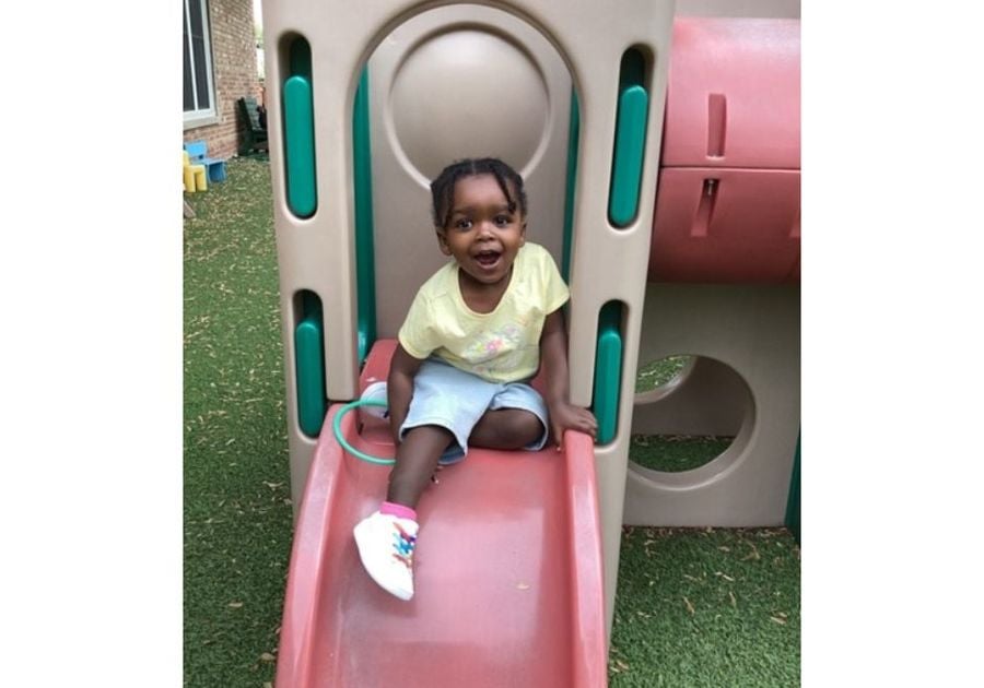 toddler on indoor slide