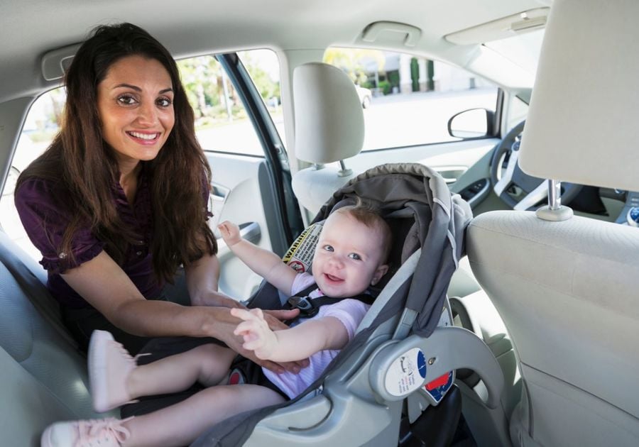 Mom checking Car Seat