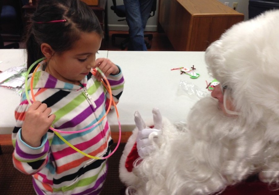 santa talks to little girl light up the holidays
