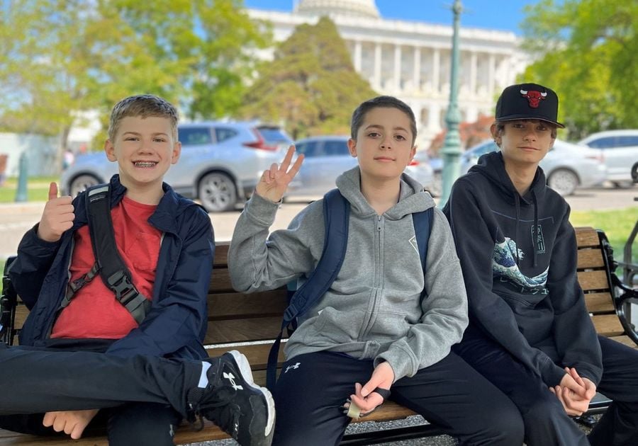 three middle school boys in front of US Capitol