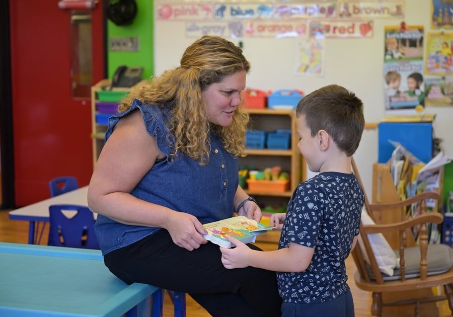 teacher reading to student