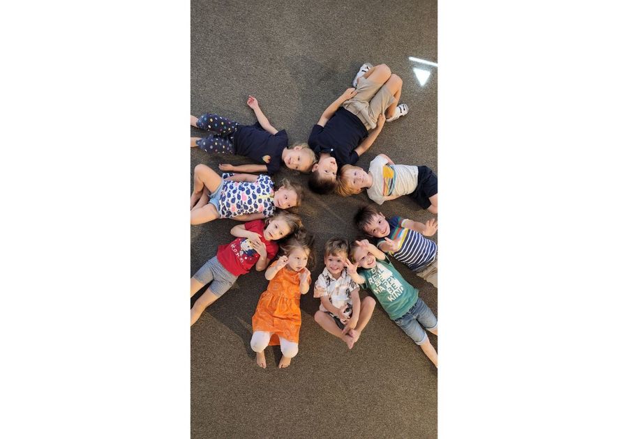 kids lying on floor in circle