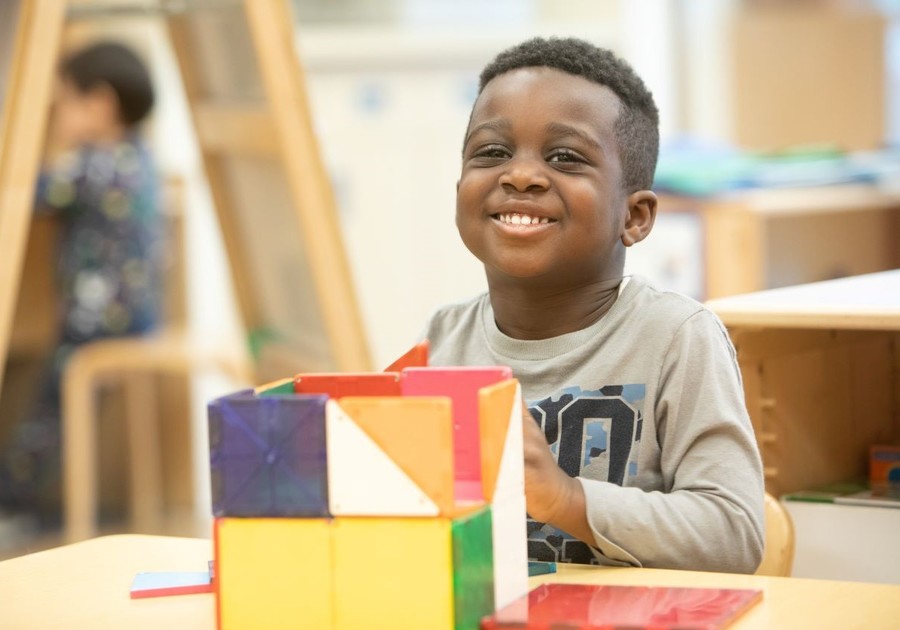 boy playing with magnatiles