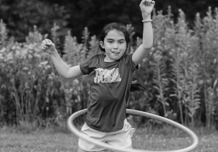 Camp Wonderkin Logo child hula hooping