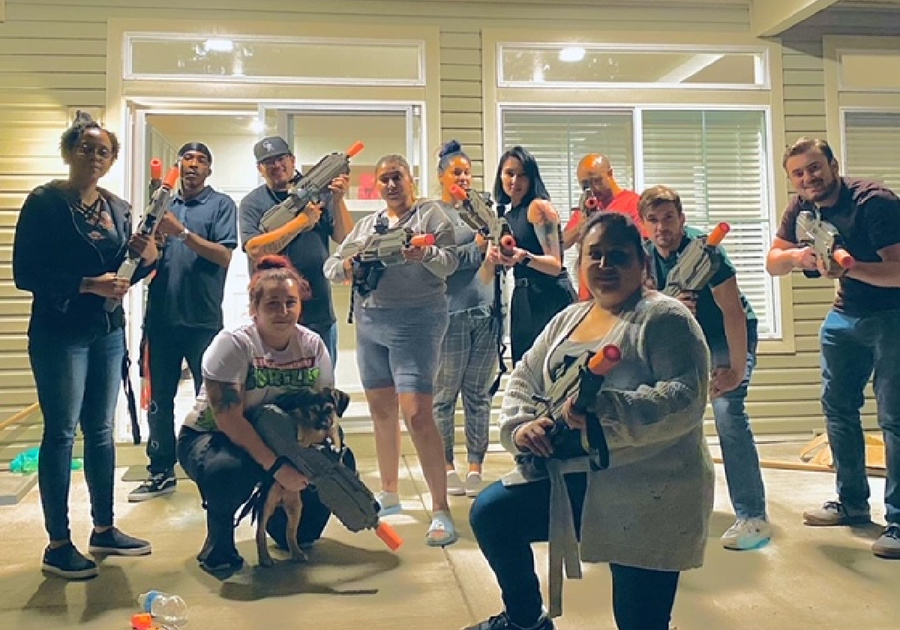 a group of people getting ready to play laser tag