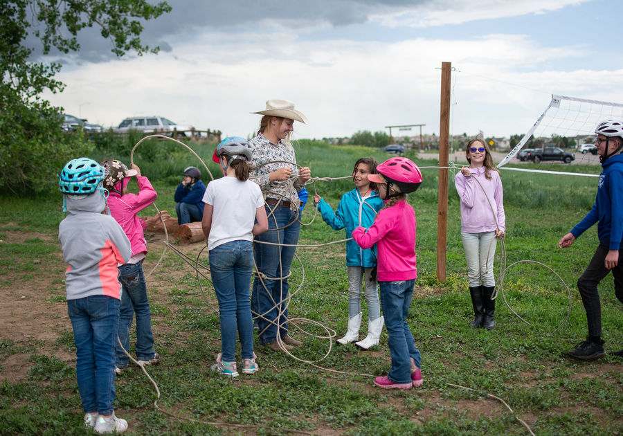 children learning to lasso at Big Horn Stables summer camp