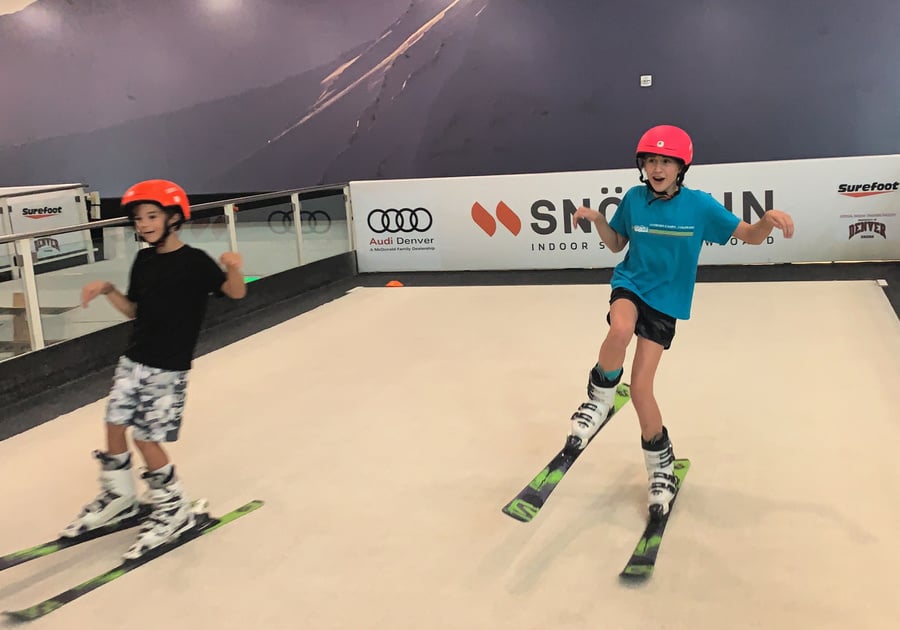 smiling teens practice skiing at Snobahn summer camp