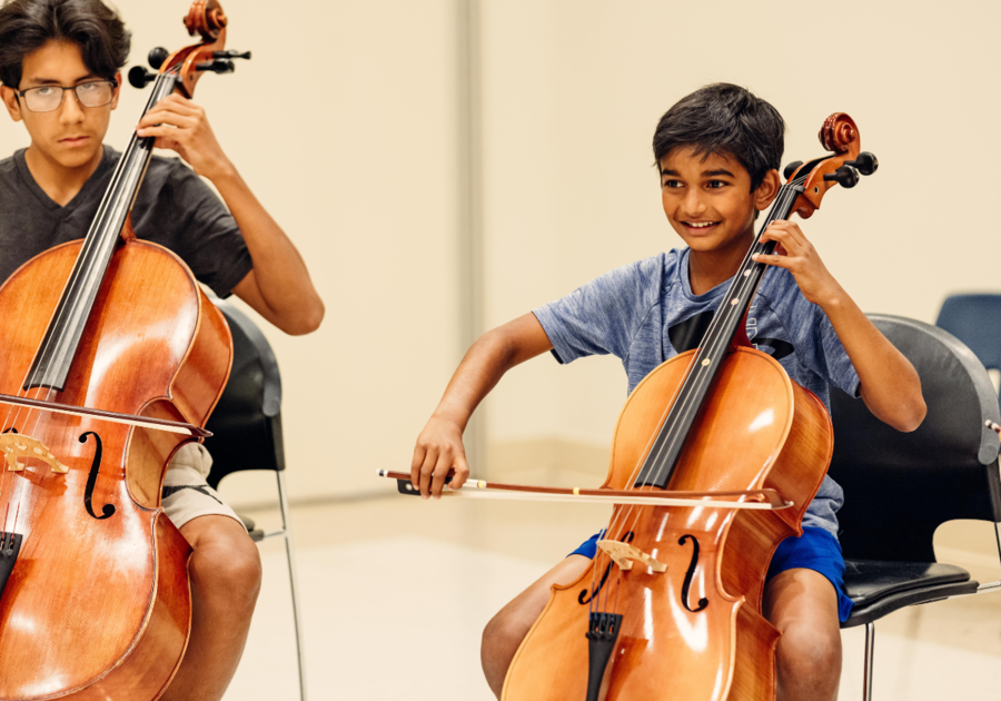 two boys playing the cello