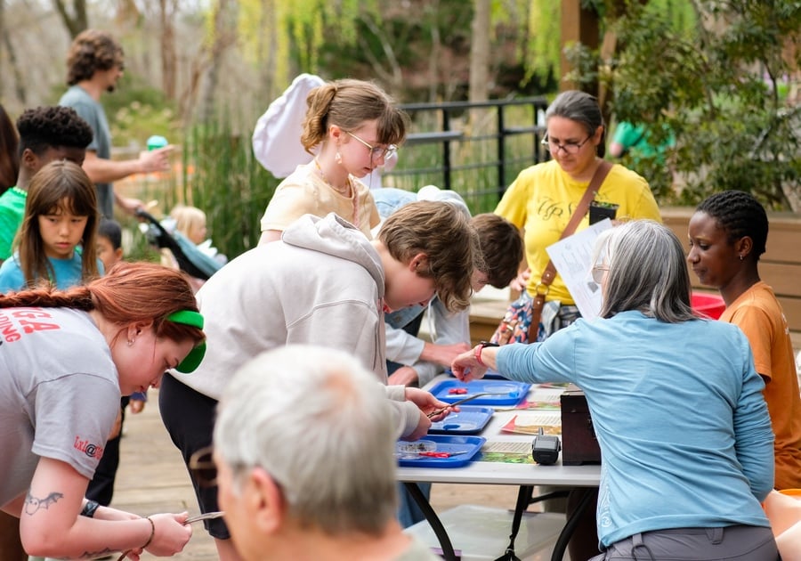 photo of visitors completing scavenger hunt at table