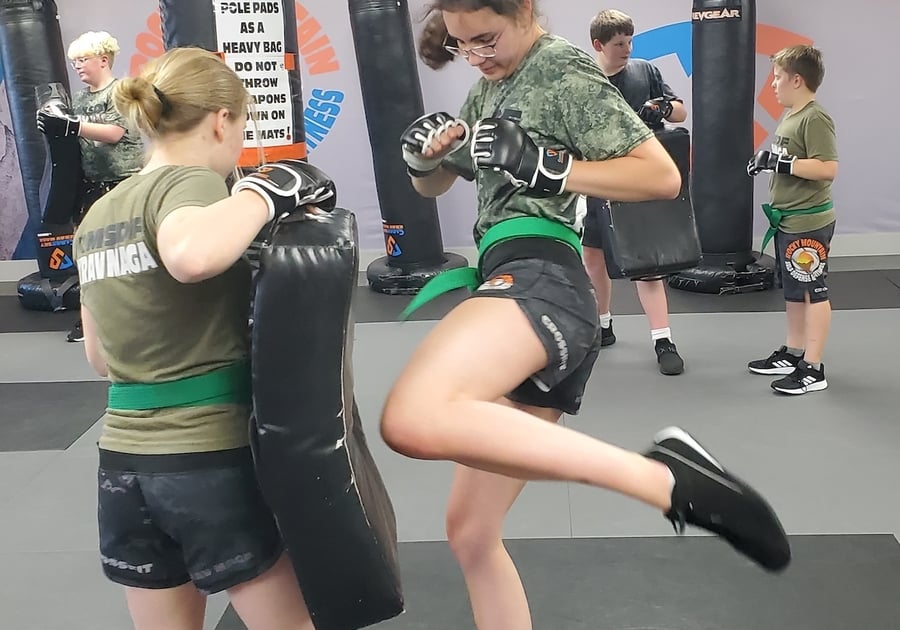 two female teens practicing krav maga martial arts