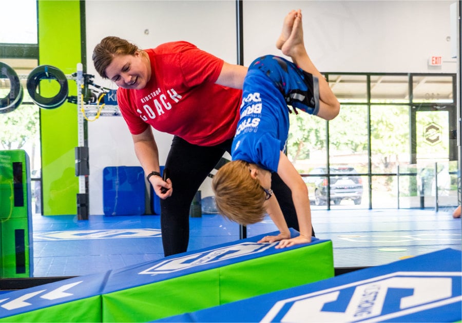 child tumbling in a kidstrong class