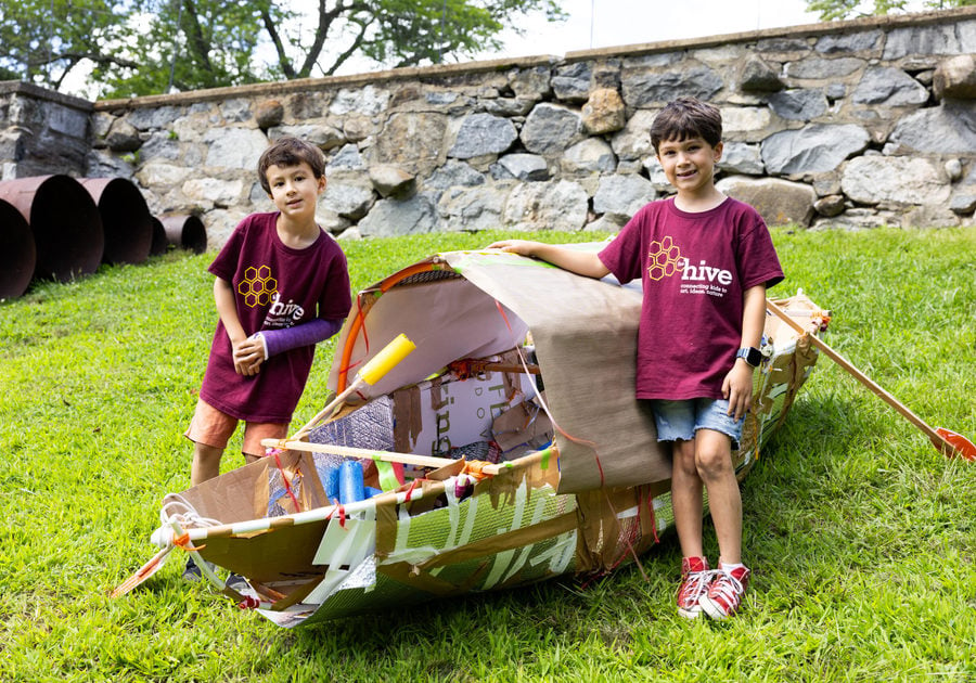 Two children with a boat