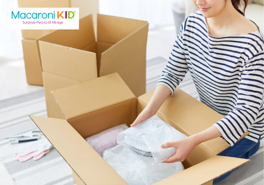 woman packing kitchen items in box