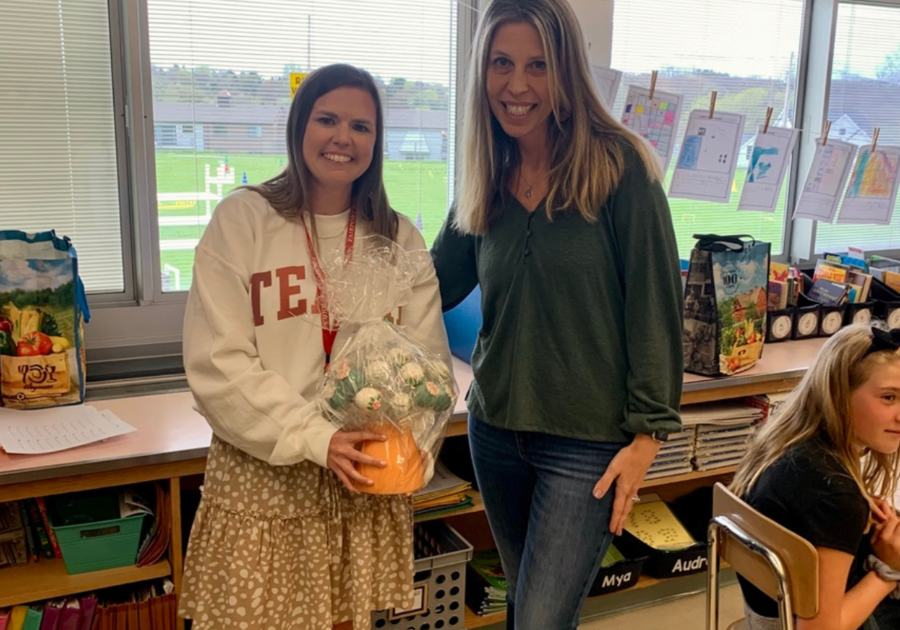 Publisher Kelly Zaryk, right, and the teacher who won her Teacher Appreciation Award