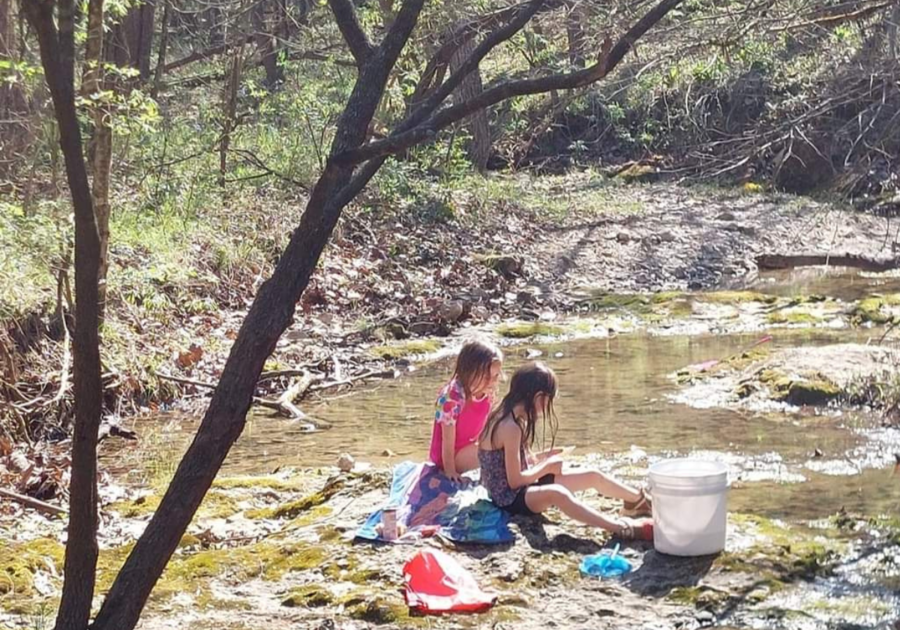 kids playing in a creek