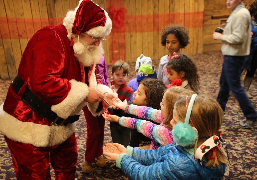 Santa greeting children