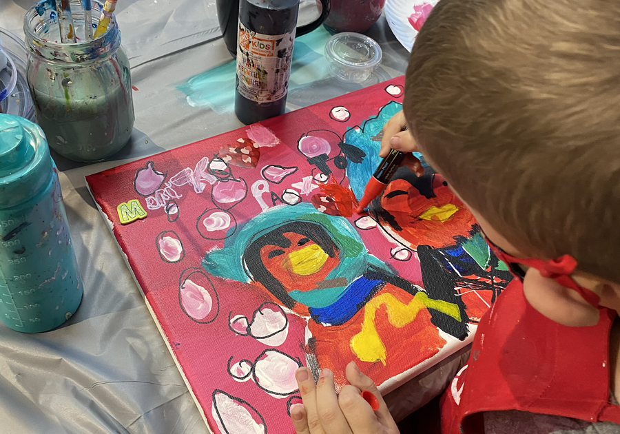 boy painting on canvas at Createry Workshop Highlands Ranch