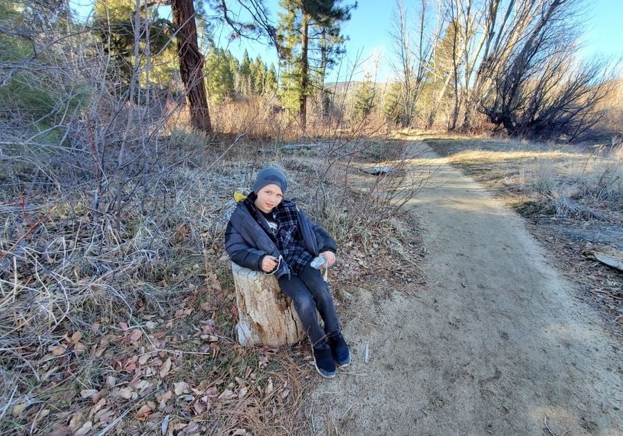 boy on log on path family kids things to do events happenings local reno sparks Spanish springs nevada deals discounts fun attractions ideas places to go outdoors hiking verdi trails park crystal peak